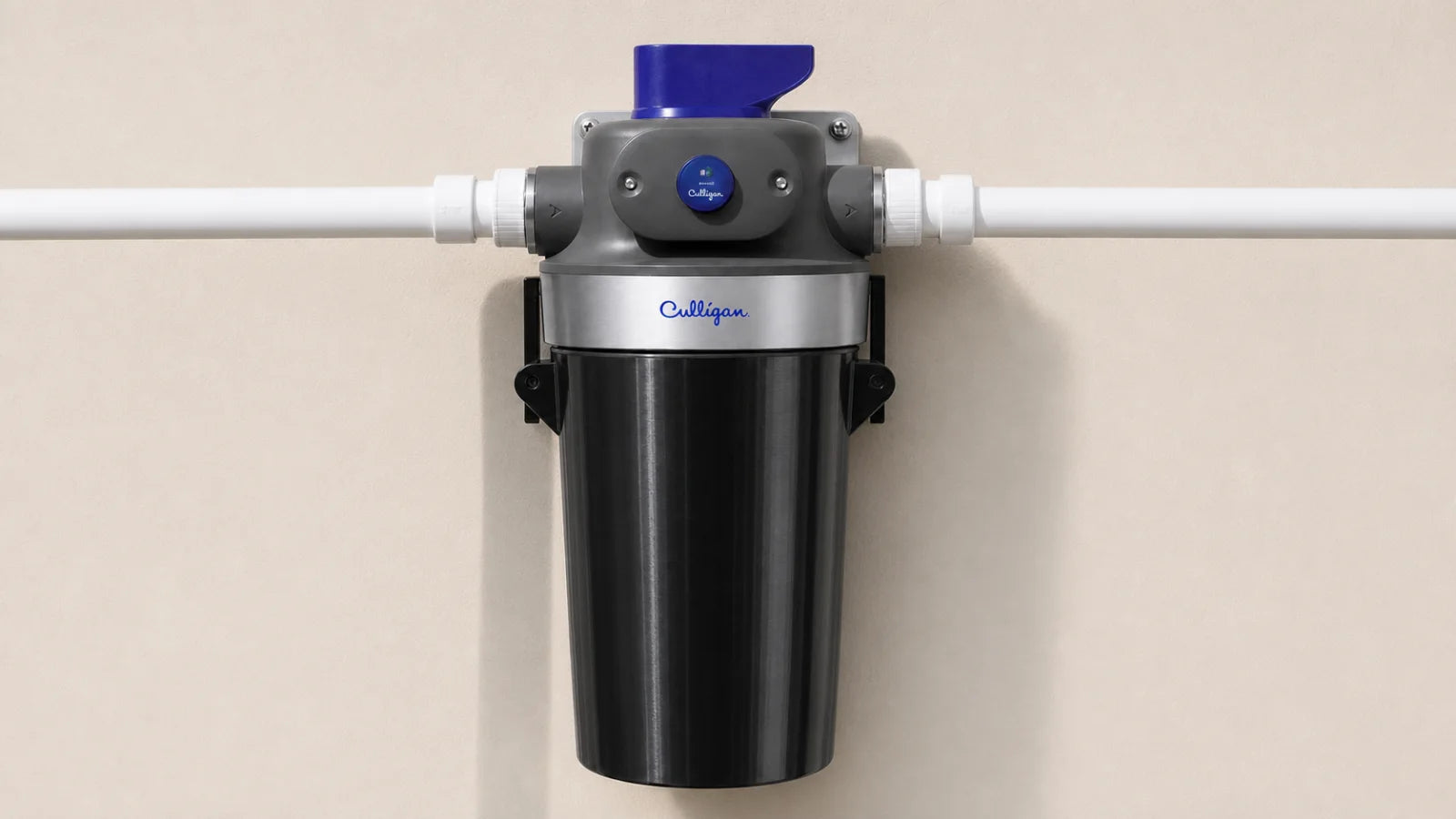 Fitted Part For That cover installed on a clear whole-house water filter housing